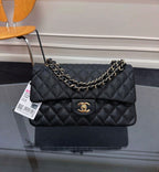 Chanel Classic Double Flap Bag (Black Caviar Leather with Gold Hardware)